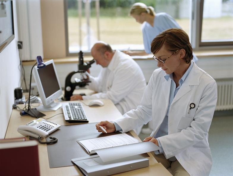 picture of scientists working at the bench